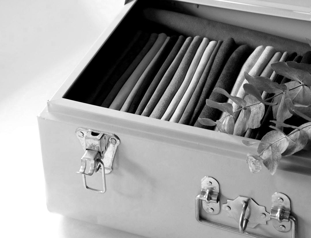 blue and white books on white wooden drawer blue and white books on white wooden drawer