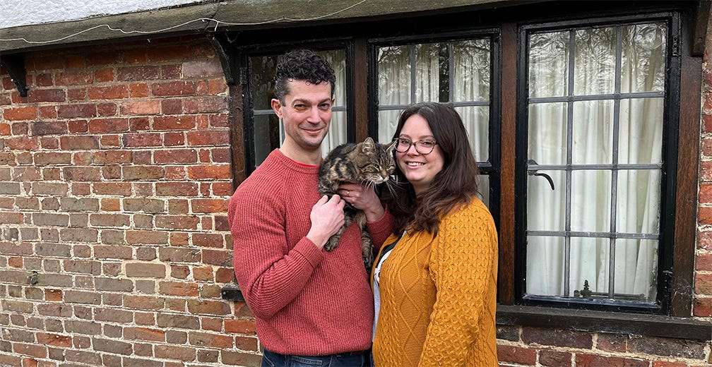 Chip, Tito the kitten, and Emma outside Samuel Pepys' Tudor cottage