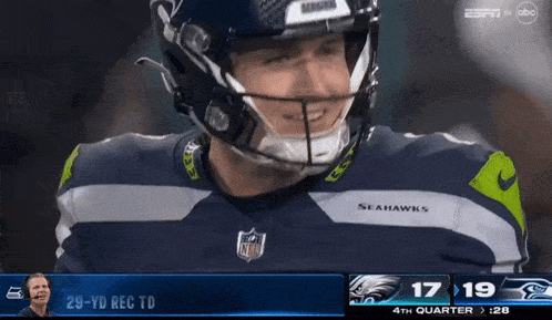 a football player wearing a seahawks jersey looks at the camera a football player wearing a seahawks jersey looks at the camera