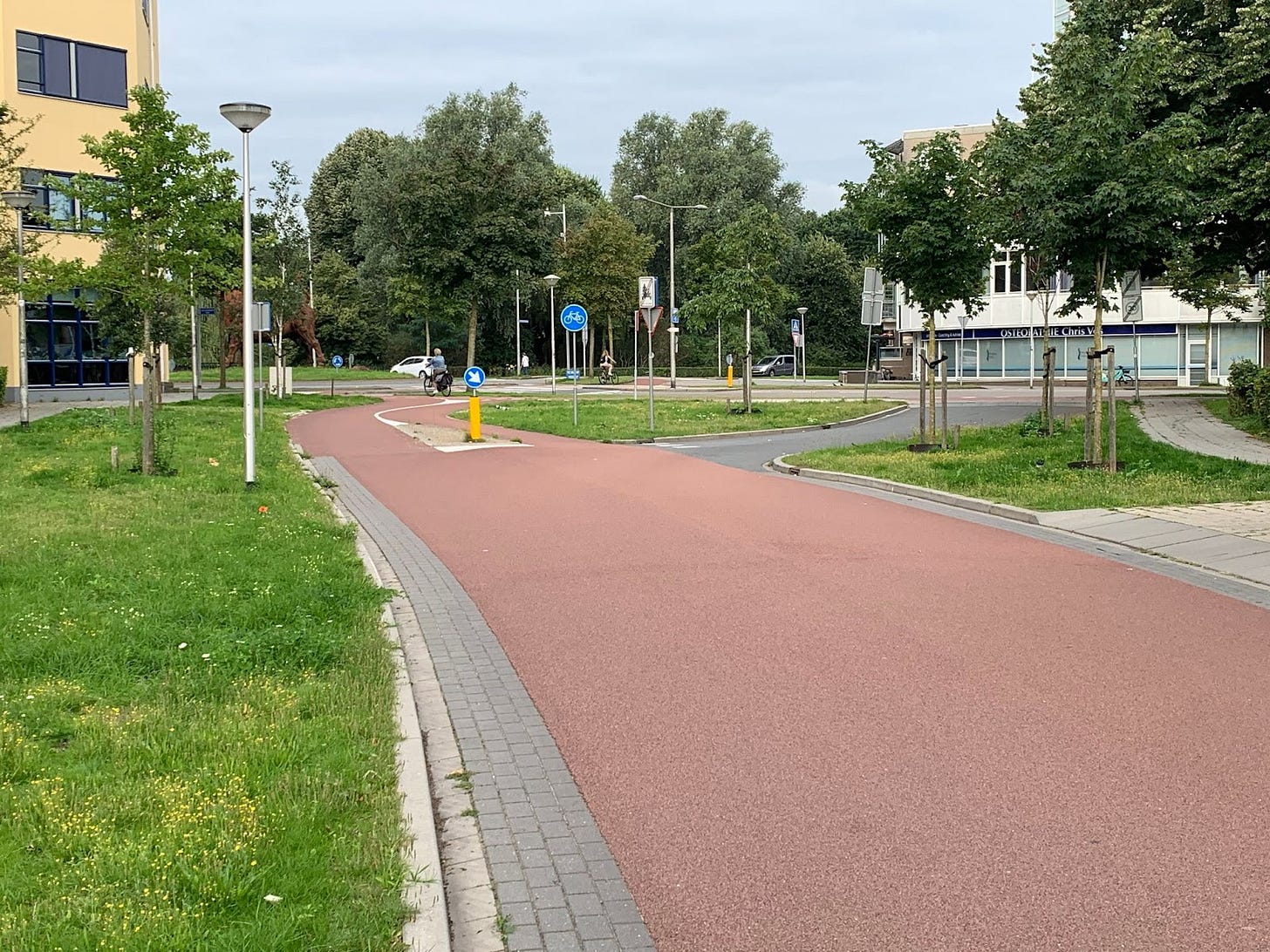 A google streetview screenshot showing a red roadway.