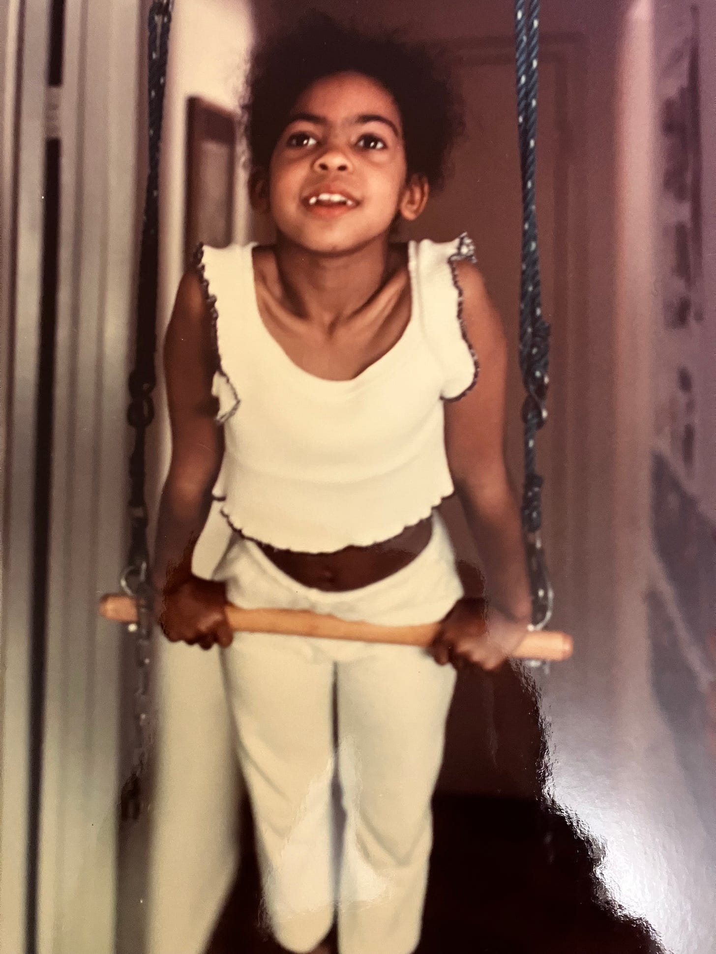 Lisa practicing on her mini trapeze, at 8 years old