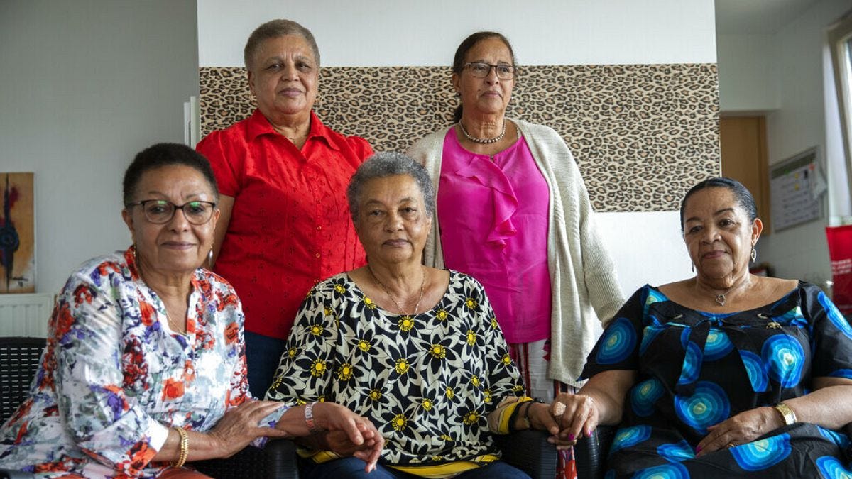 Simone Ngalula, Monique Bitu Bingi, Lea Tavares Mujinga, Noelle Verbeeken and Marie-Jose Loshi pose for a group photo in Brussels, Belgium, June 29, 2020