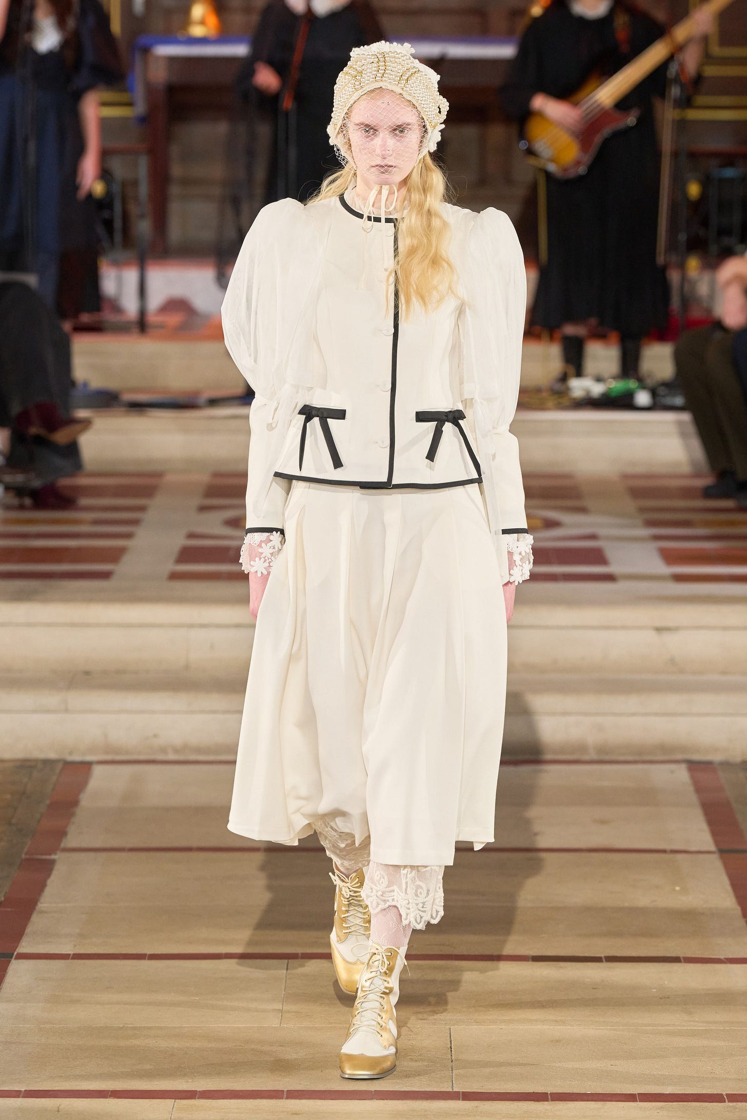 Image may contain Christelle Lefranc Person Adult Clothing Coat Guitar and Musical Instrument Image may contain Christelle Lefranc Person Adult Clothing Coat Guitar and Musical Instrument