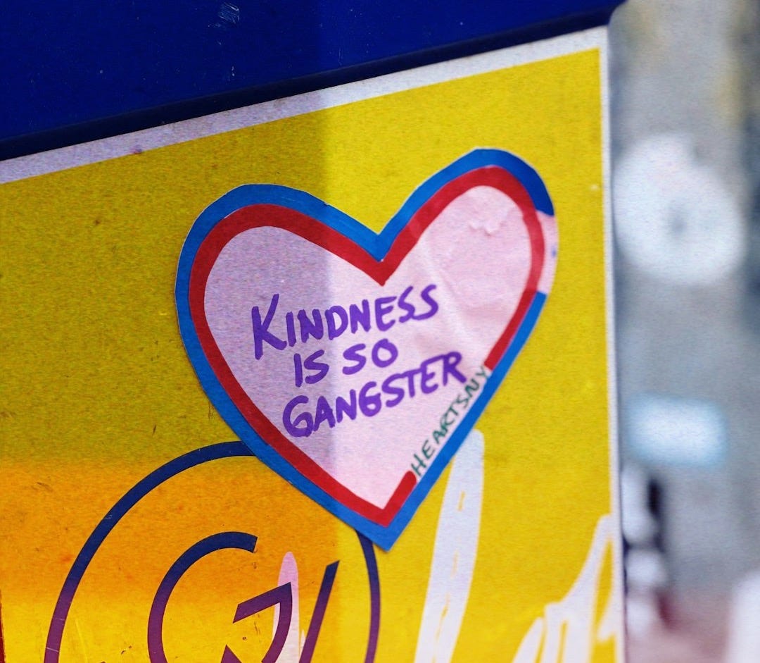a close up of a sign with a heart on it