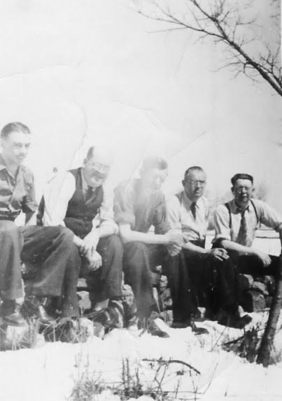 Five seated men
