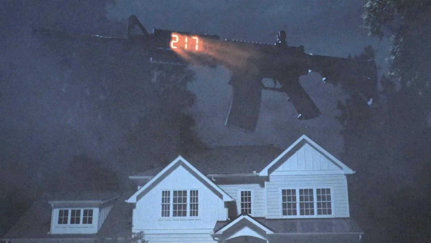 A rifle floats above a house in Weapons