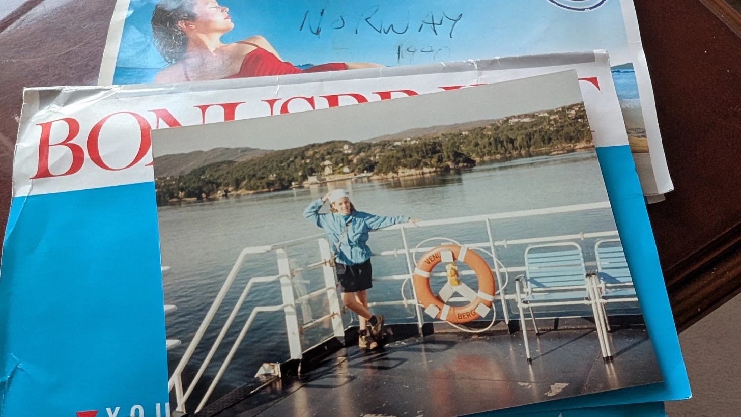 A girl (me) wearing a sailor hat on a boat
