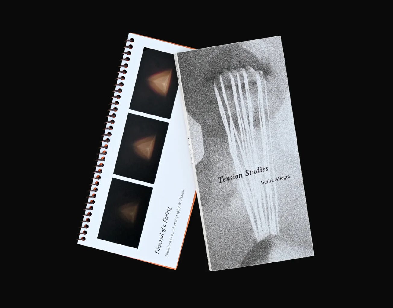An image of two poetry books against a black background.