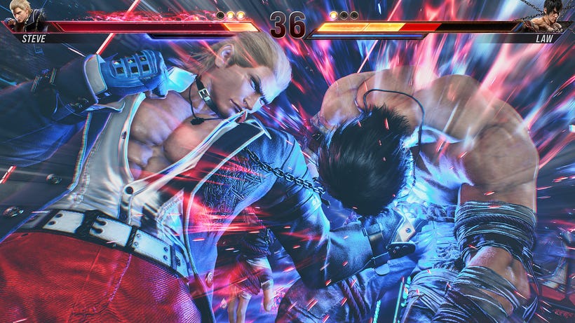 Two fighters, Steve and Law, fight. Steve drives his left fist into Law's gut with a powerful uppercut Two fighters, Steve and Law, fight. Steve drives his left fist into Law's gut with a powerful uppercut