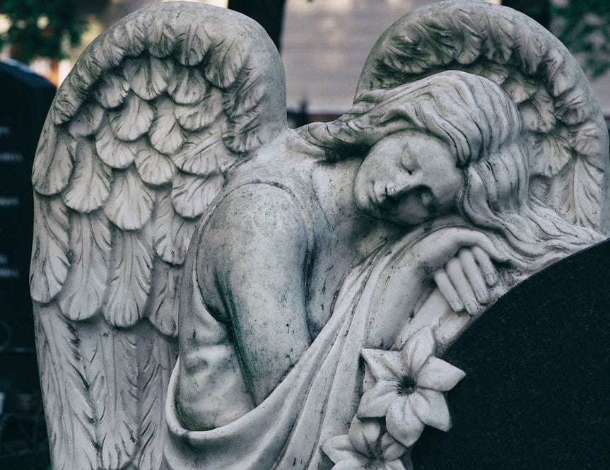 gray scale photo of angel statue gray scale photo of angel statue