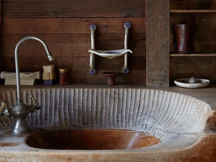 blunk&#8\2\17;s hand hewn bathroom sink, with marks from his chisel. 15