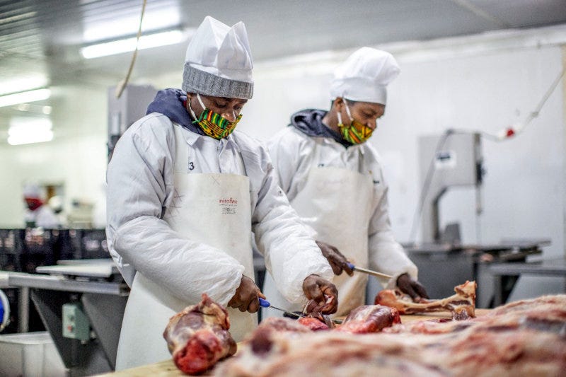 Employees at Kachema Meat's processing facility.
