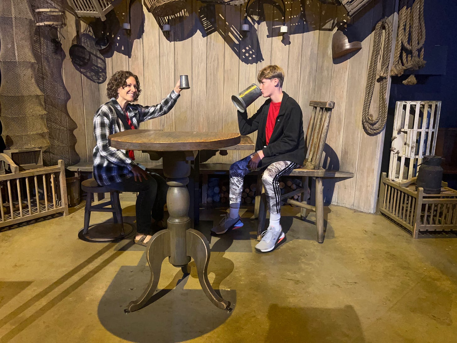 Becky and Hudson with a fake butter beer in a tavern