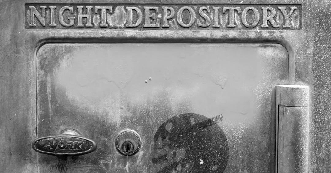 a close up of a metal door with a lock