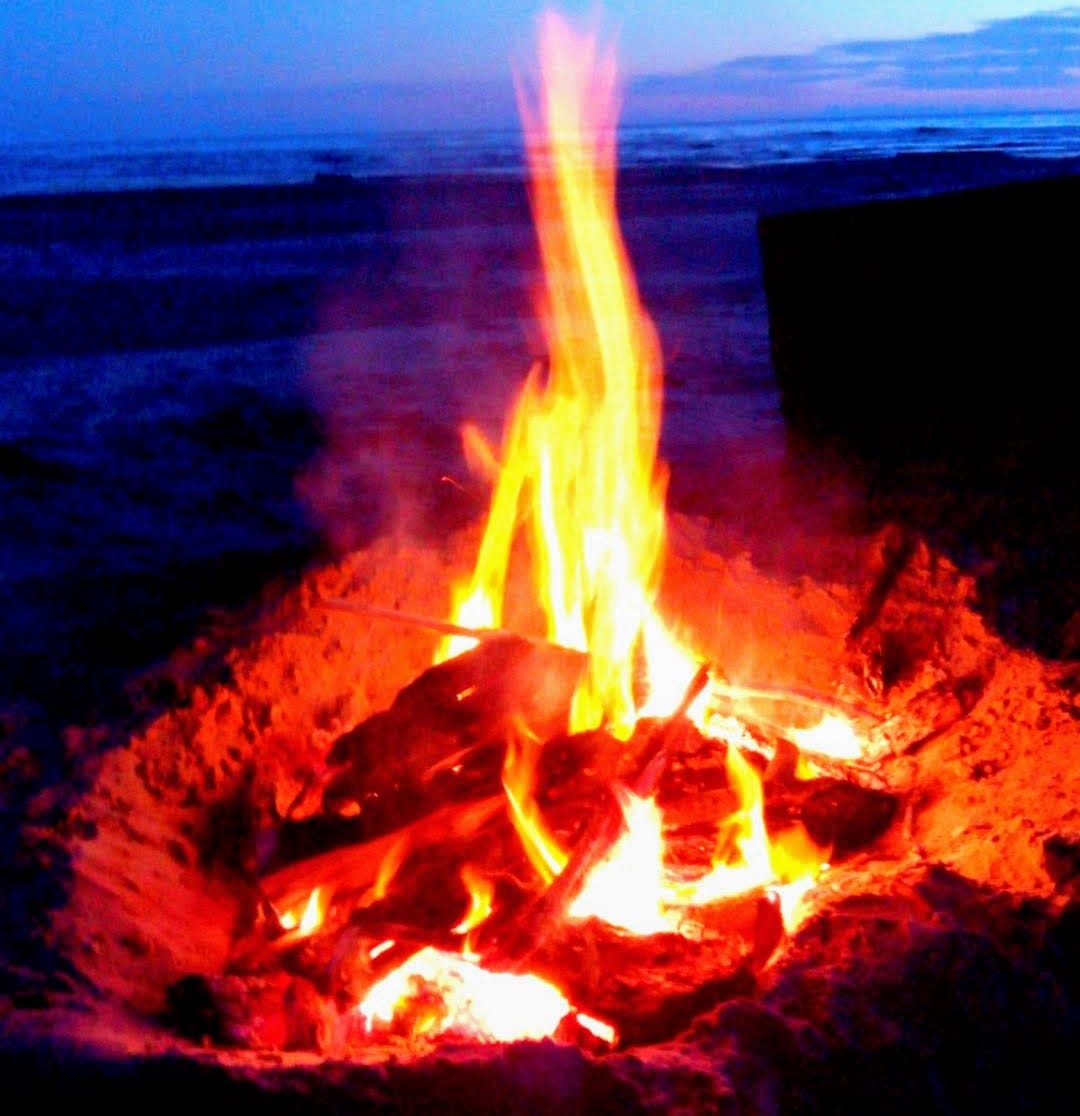 a bright orange campfire blazing