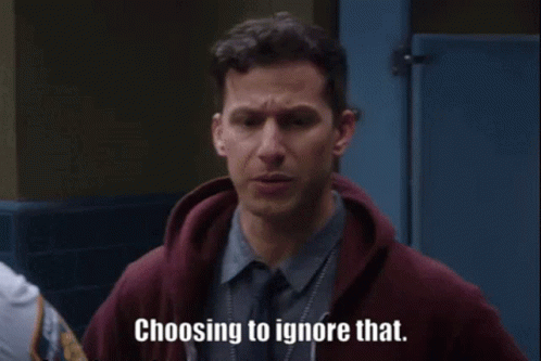 a man in a hoodie is talking to another man in a bathroom . a man in a hoodie is talking to another man in a bathroom .