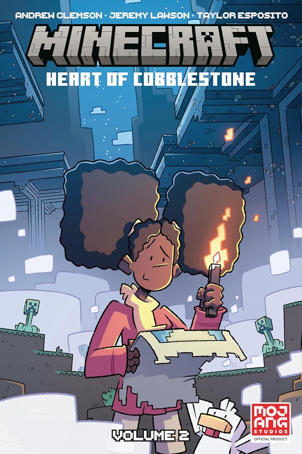 Comic-style cover for Minecraft: Heart of Cobblestone, Volume 2 showing a girl with large puffy hair holding a torch and a map inside a blocky cavern. Creepers lurk in the background, and a chicken stands at her feet, with the Minecraft logo at the top and the Mojang Studios badge in the corner.