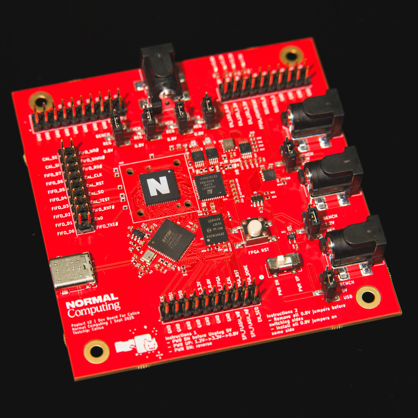 A red thermodynamic computing chip with many buttons and an 'N' for Normal Computing