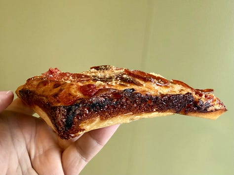 Pictures of pizza slices from Sid's