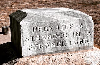 Here lies a stranger in a strange land