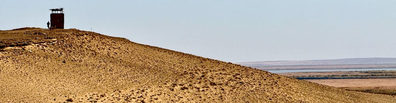 A hill with a hill in the background

AI-generated content may be incorrect.