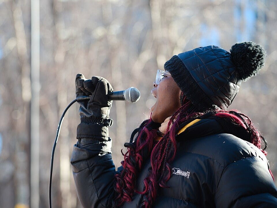File:Speaker shouts to the crowed at a protest against ICE.jpg