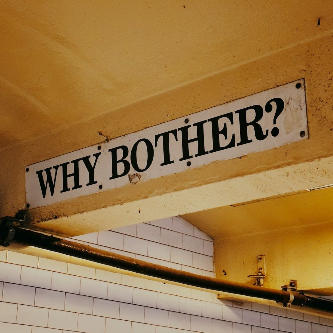 a sign that reads, why brother? above a tiled wall a sign that reads, why brother? above a tiled wall