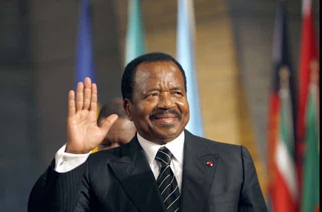 A man wearing a grey suit 