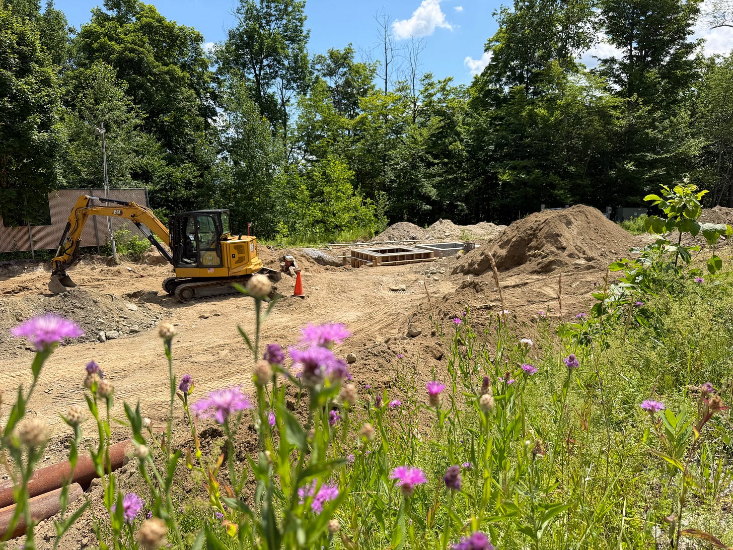 Construction crews prepare the building that will house Okemo's new electric snowmaking compressors.