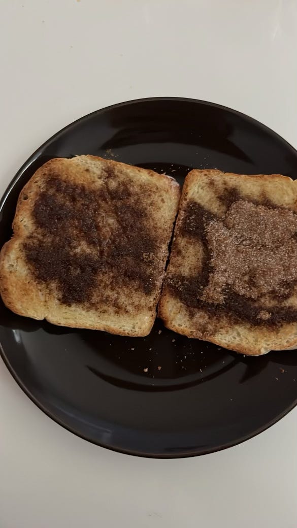 two pieces of toast with butter and chai cinnamon sugar