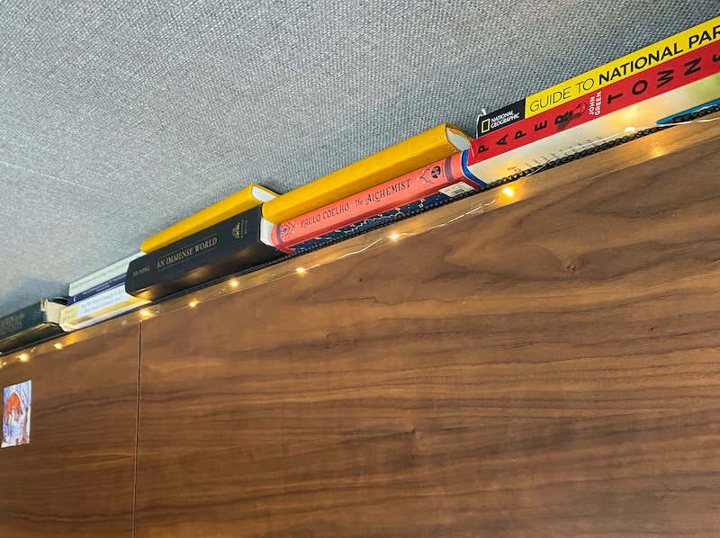 Our bookshelf in our converted camper van