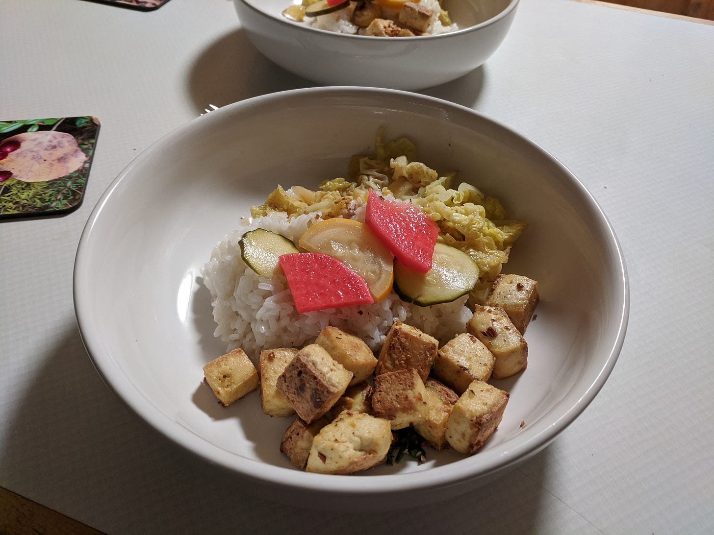 beige bowl of tofu and rice