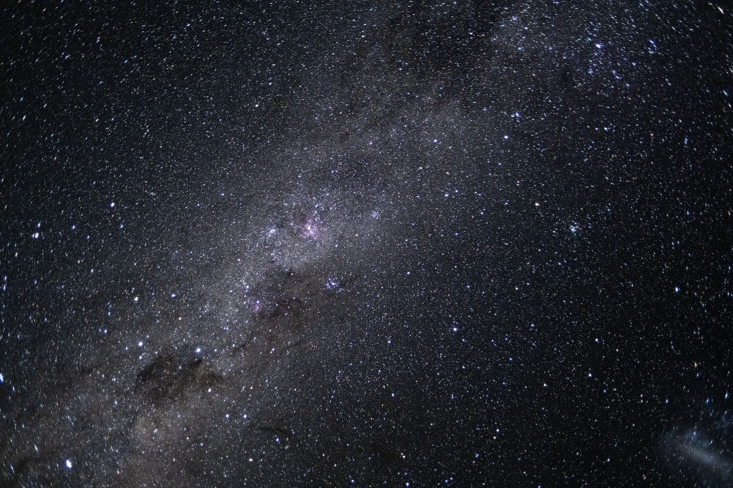 The Milky Way galaxy appears as many points of light dotting the blackness of space. The Milky Way galaxy appears as many points of light dotting the blackness of space.