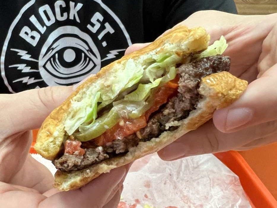 Half eaten burger from Pad in Topeka, Kansas