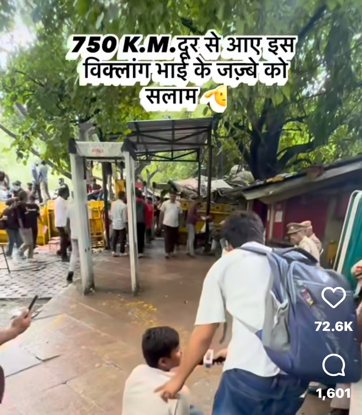 A reporter intervieweing a person with a locomotor disability. Translated Caption reads, “saluting the zeal of a disabled person for covering 750 km to come here.” A reporter intervieweing a person with a locomotor disability. Translated Caption reads, “saluting the zeal of a disabled person for covering 750 km to come here.”