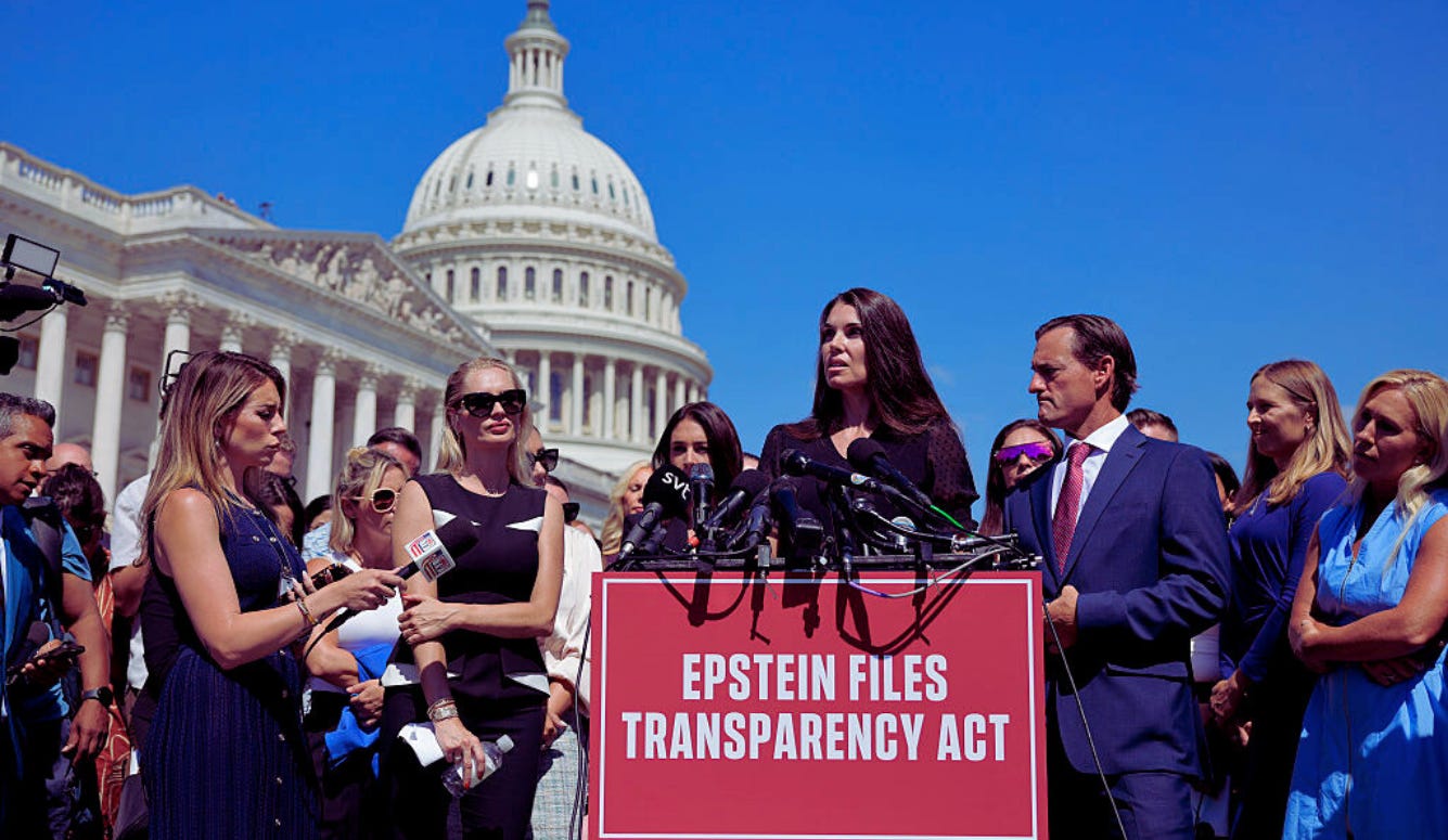 Woman addresses press at microphones outside US Capitol, sign reading “Epstein Files Transparency Act” Woman addresses press at microphones outside US Capitol, sign reading “Epstein Files Transparency Act”