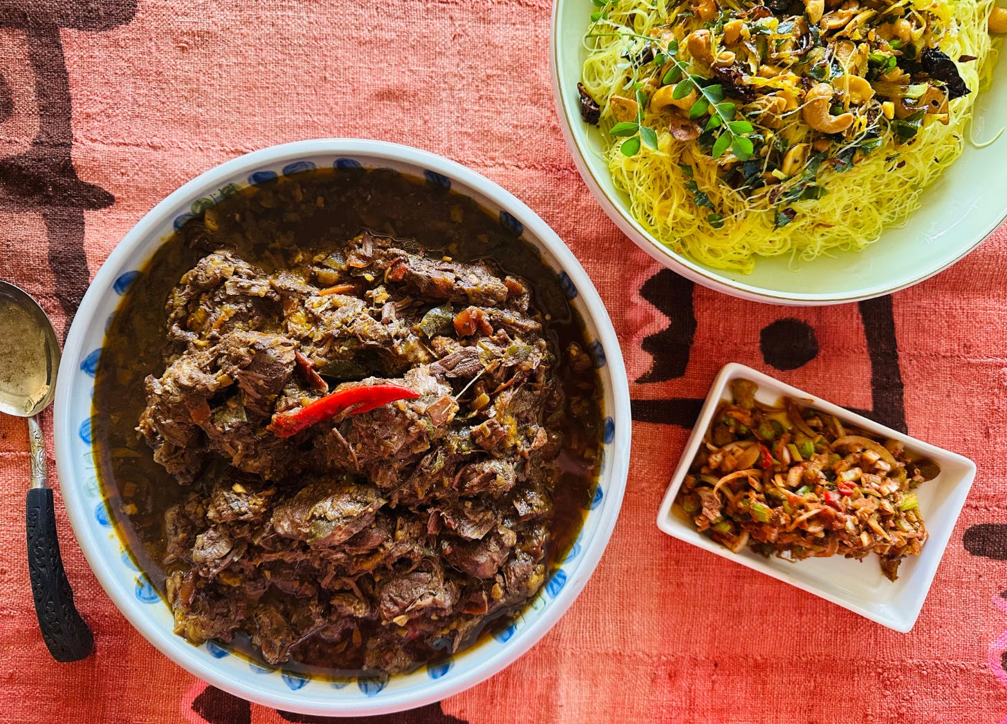 A Sri Lankan beef curry with a side dish or lunu miris