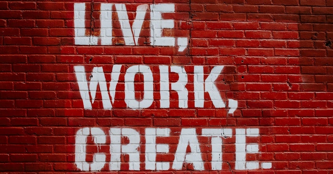 Live, Work, Create. graffiti on brick wall Live, Work, Create. graffiti on brick wall