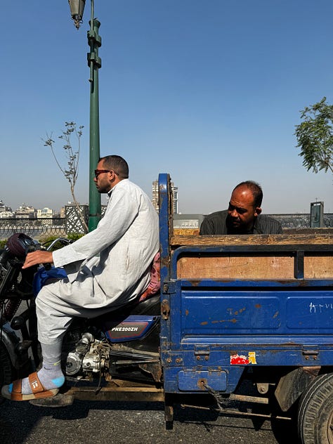 CFW Scenes: Nile views from Fairmont Nile City, Pharaoh Ramses II at Grand Egyptian Museum, Zooba maze spread, Koshari, Karime Lopez Purple Corn Todtada, Pyramids of Giza, Crème Caramel & Orzo Pasta & Two men driving through Nile City