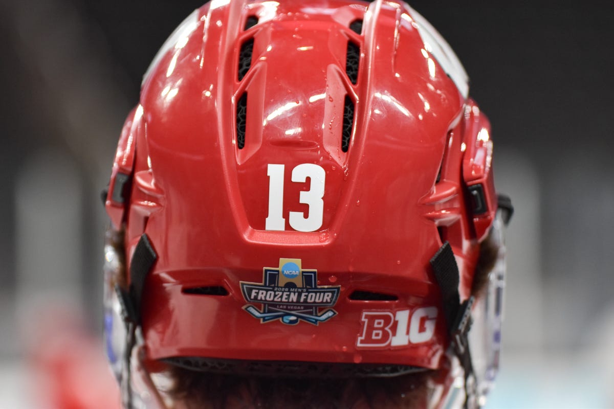 Number thirteen. Christian Fitzgerald red helmet with NCAA Frozen Four and Big Ten logo