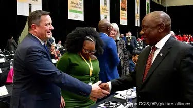 Cyril Ramaphosa und John Steenhuisen shake hands at the first sitting of South Africa's Parliament since elections Cyril Ramaphosa und John Steenhuisen shake hands at the first sitting of South Africa's Parliament since elections