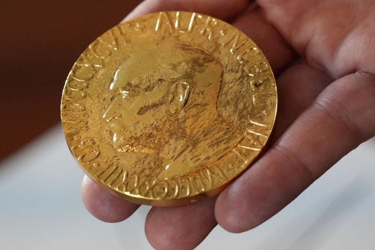 FILE PHOTO: An employee of the Norwegian Nobel Institute holds a replica of a Nobel Peace Medal in the Institute in Oslo, Norway, September 9, 2025 FILE PHOTO: An employee of the Norwegian Nobel Institute holds a replica of a Nobel Peace Medal in the Institute in Oslo, Norway, September 9, 2025