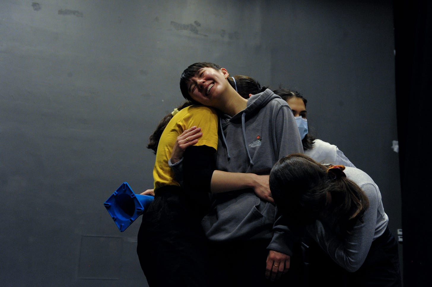 dancers hug and smile dancers hug and smile