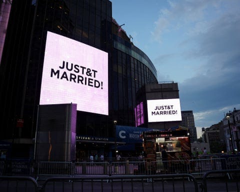 A screen outside Madison Square Garden displays a message referencing singer Taylor Swift and NFL player Travis Kelce’s wedding