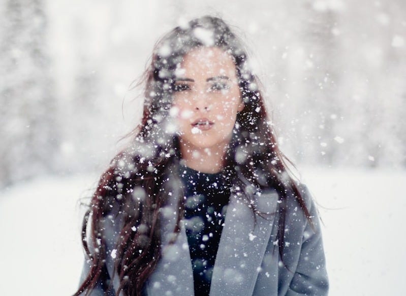 selective focus photograph of woman in gray coat