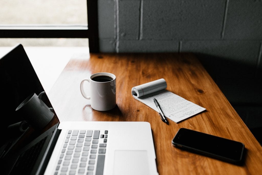 A Macbook, coffee, pen, paper and phone sit on a desk by a window. Seems like a good writing setup. Photo by Andrew Neel on Unsplash A Macbook, coffee, pen, paper and phone sit on a desk by a window. Seems like a good writing setup. Photo by Andrew Neel on Unsplash