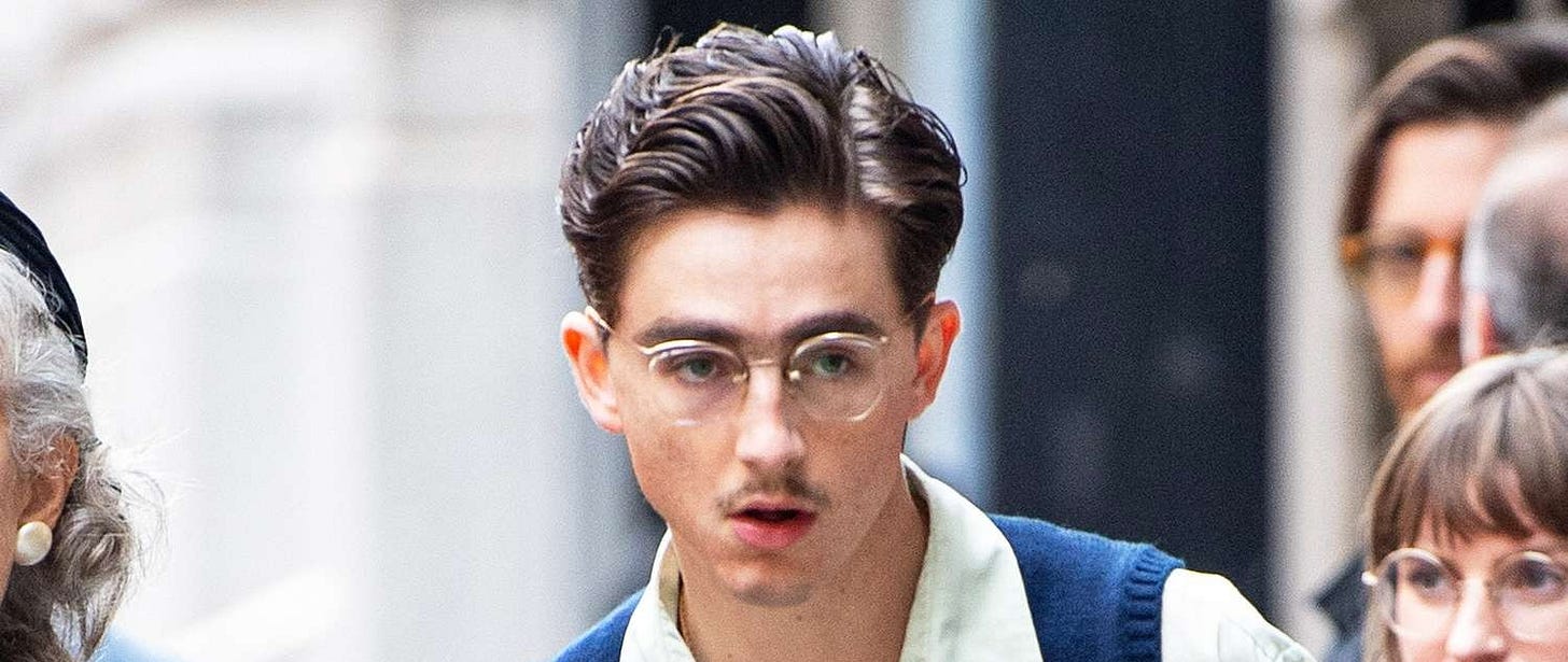 Timothée Chalamet Sports Mustache, Glasses on 'Marty Supreme' Set: Photos Timothée Chalamet Sports Mustache, Glasses on 'Marty Supreme' Set: Photos
