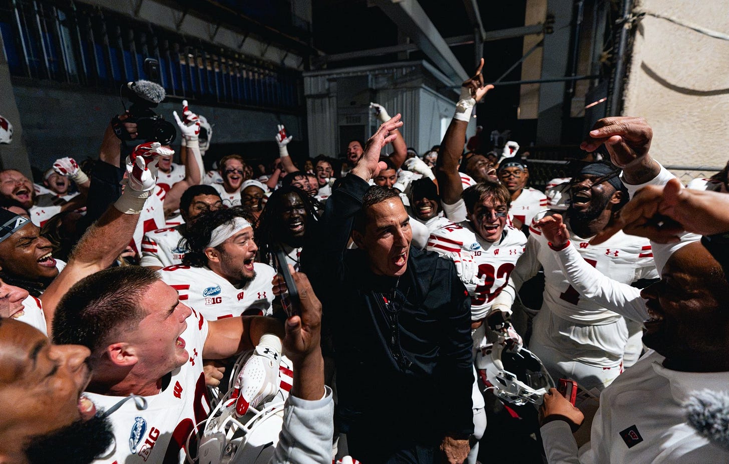 Wisconsin head coach Luke Fickell celebrates with his players after the Badgers’ win over Penn State. Wisconsin head coach Luke Fickell celebrates with his players after the Badgers’ win over Penn State.