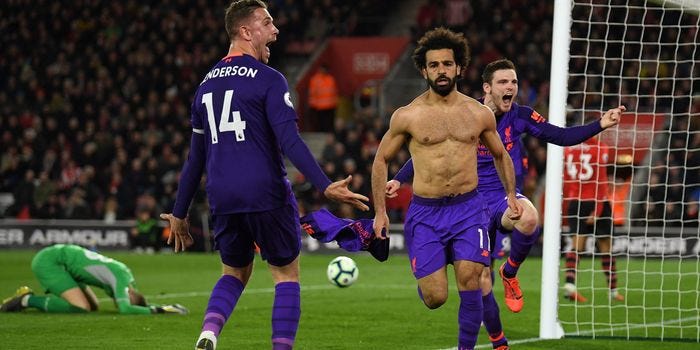 Mohamed Salah celebrates scoring against Southampton with Jordan Henderson and Andy Robertson in 2019