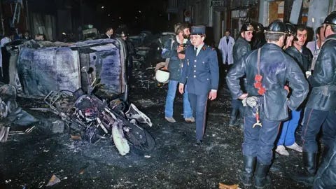 AFP A picture taken on October 3, 1980 shows firemen standing by the wreckage of a car and motorcycle after a bomb attack at a Paris synagogue rue Copernic killing four people